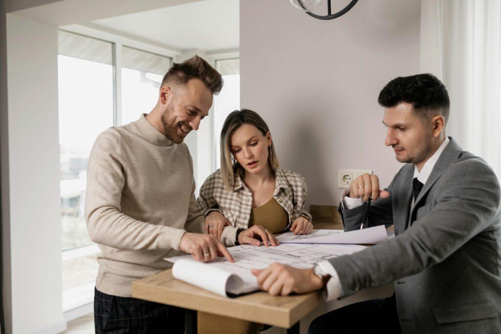 Client meeting in place YML Finance broker discussing options for low interest home loans with a client